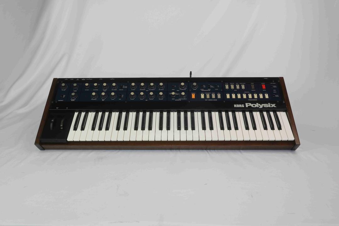 Korg -  Polysix in solid walnut case (serviced)