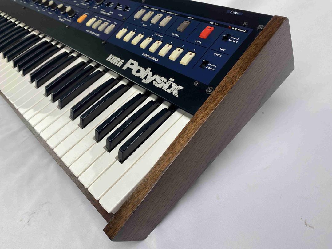 Korg -  Polysix in solid walnut case (serviced)